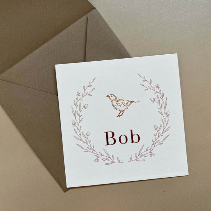 Geboortekaartje unisex met bloemenkrans en vogel