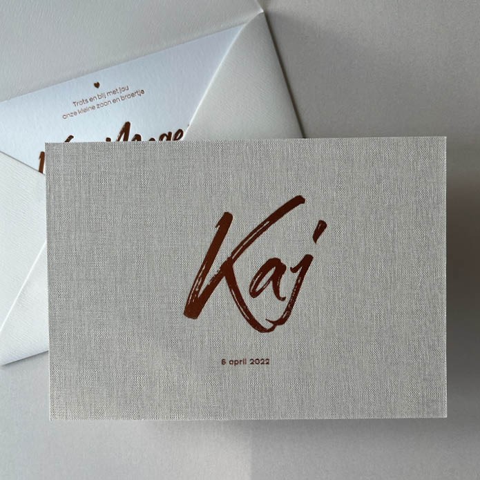 Écht linnen geboortekaartje met matte koper foliedruk